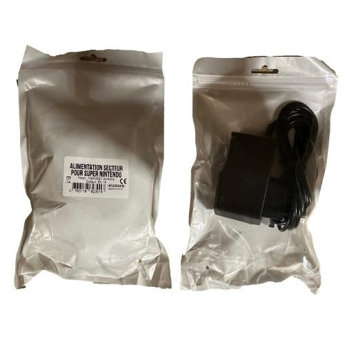 Trade Invaders Super Nintendo AC-adapter (i freaks and geeks-påsar + etiketter) i gruppen HEMELEKTRONIK / Spelkonsoler & Tillbehör / Nintendo 3DS hos TP E-commerce Nordic AB (D15509)